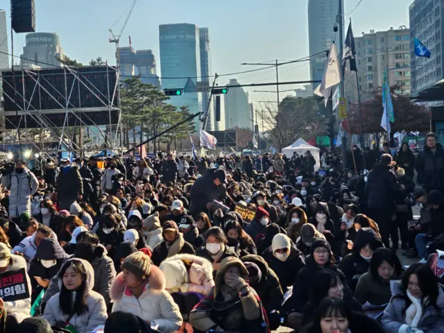 Protesters have already gathered in their hundreds on a Saturday afternoon