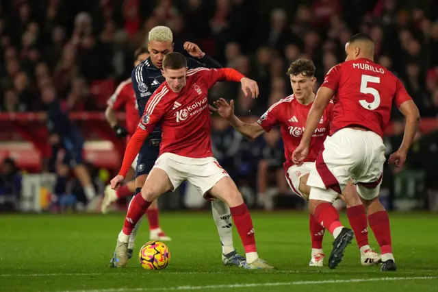 Aston Villa's Morgan Rogers and Nottingham Forest's Elliot Anderson battle for the ball