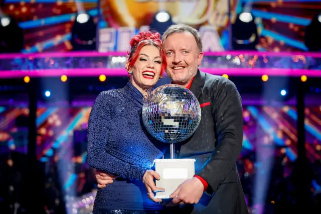 Chris and Dianne holding the Glitterball trophy