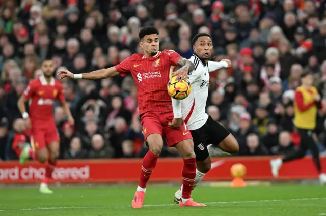 Luis Diaz of Liverpool is challenged by Kenny Tete of Fulham