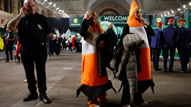 Spectators dressed as traffic cones