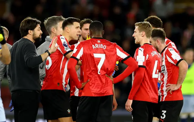 Russell Martin talks to his side after they go 4-0 down against Spurs