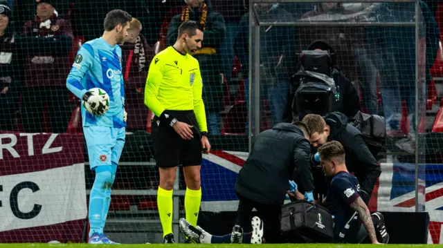 Hearts' Frankie Kent goes off injured during a UEFA Conference League 2024/25 League Phase MD5 match between FC Copenhagen and Heart of Midlothian at Parken Stadium