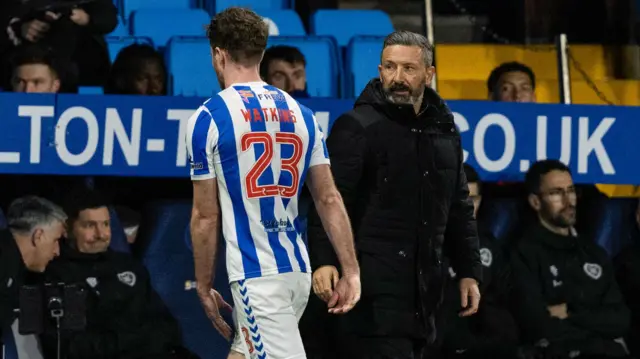 Kilmarnock's Marley Watkins (L) and manager Derek McInnes (R) as he is substituted during a William Hill Premiership match between Kilmanock and Heart of Midlothian at Rugby Park,