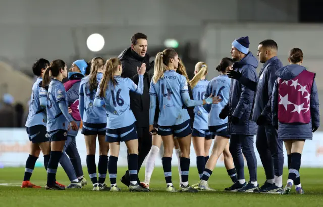 Man City players high five after the Polten game