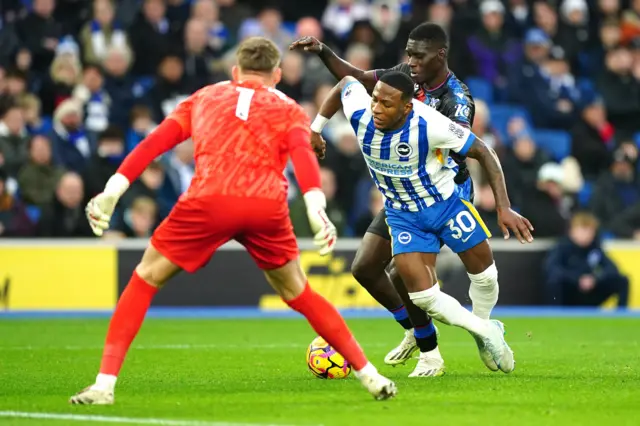 Crystal Palace's Ismaila Sarr challenges Brighton and Hove Albion's Pervis Estupinan