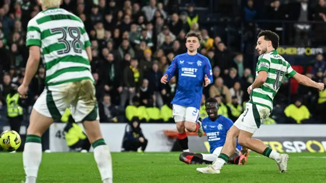 Nicolas Kuhn scores for Celtic against Rangers