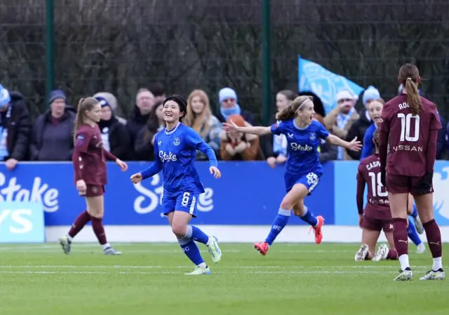 Honoka Hayashi (left) celebrates after scoring