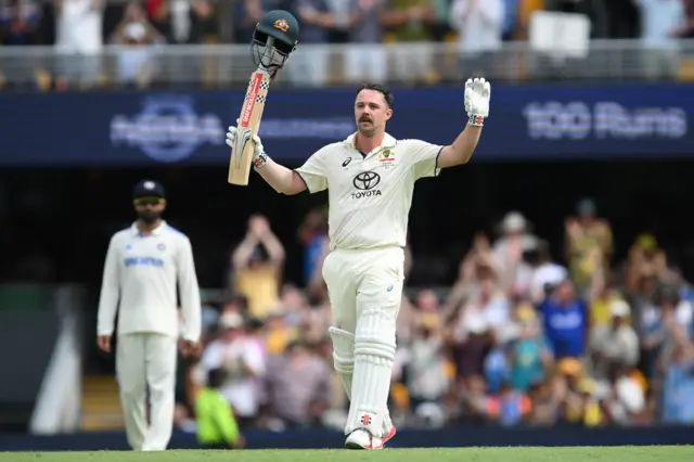 Travis Head celebrates his century