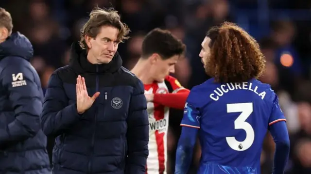 Marc Cucurella of Chelsea reacts with Thomas Frank