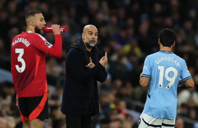 Manchester City manager Pep Guardiola reacts towards Ilkay Gundogan