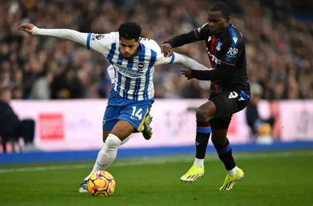 Georginio Rutter of Brighton & Hove Albion is challenged by Tyrick Mitchell of Crystal Palace