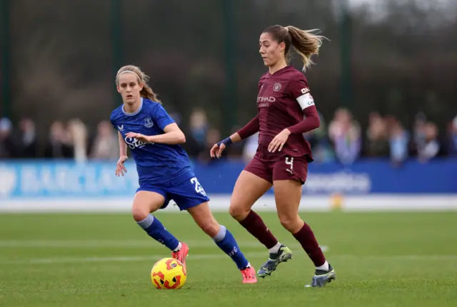 Laia Aleixandri of Manchester City runs with the ball whilst under pressure from Katja Snoeijs