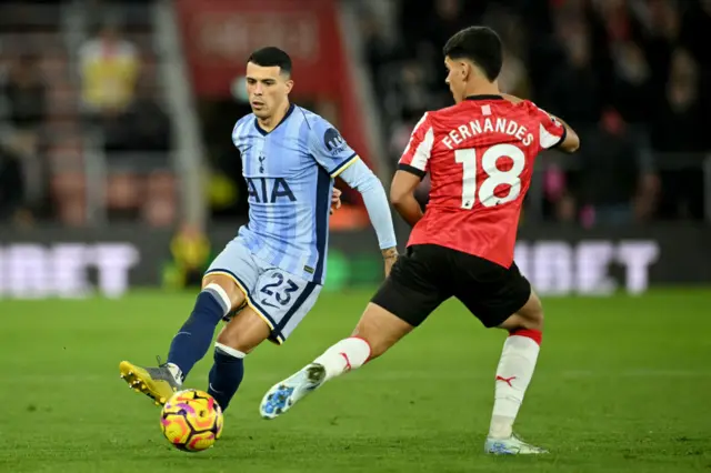 Tottenham Hotspur's Spanish defender Pedro Porro battles for the ball with Southampton's Portuguese midfielder Mateus Fernandes