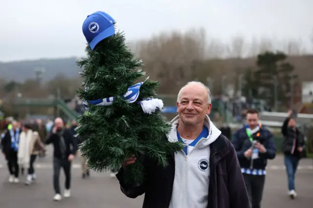 Brighton fan with a Christmas tree