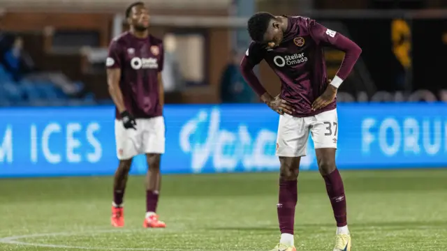 Hearts' Musa Drammeh (R) looks dejected during a William Hill Premiership match between Kilmanock and Heart of Midlothian at Rugby Park