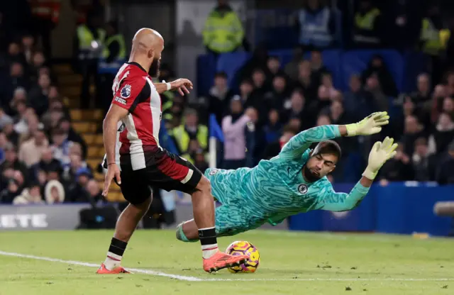 Brentford's Bryan Mbeumo in action with Chelsea's Robert Sanchez