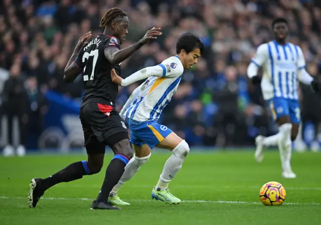 Crystal Palace's Trevoh Chalobah in action with Brighton & Hove Albion's Kaoru Mitoma