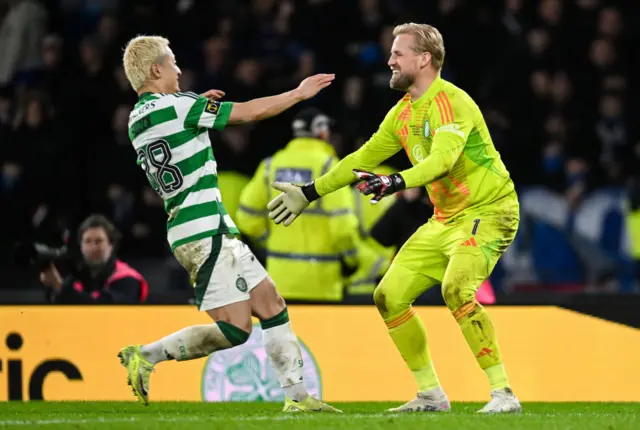 Daizen Maeda and Kasper Schmeichel celebrate at Hampden