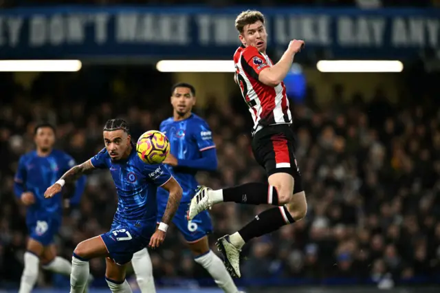 Nathan Collins jumps to head the ball