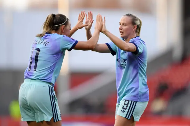 Alessia Russo of Arsenal celebrates scoring her team's first goal with teammate Katie McCabe