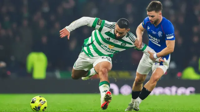 Celtic's Cameron Carter-Vickers holds off Rangers' Nico Raskin