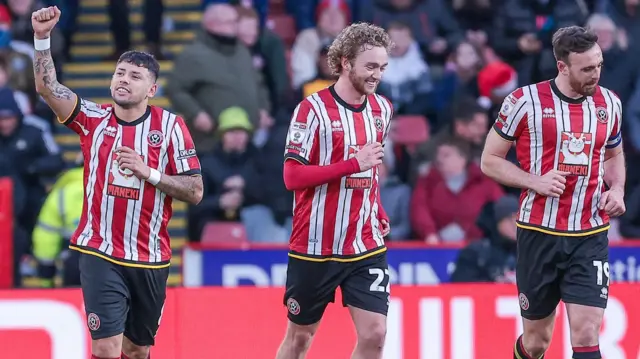 Sheffield United players celebrate scoring against Plymouth