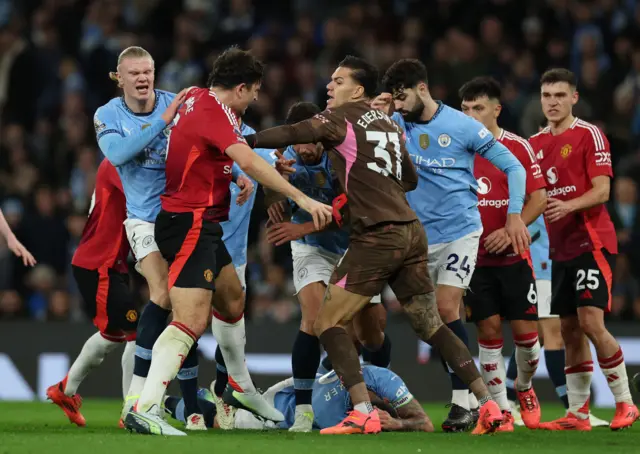 Manchester City's Kyle Walker reacts after clashing with Manchester United's Rasmus Hojlund