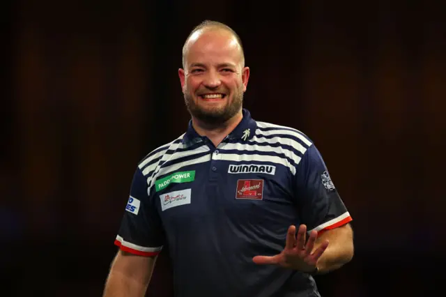 Thibault Tricole gestures while playing at the 2024 PDC World Darts Championship