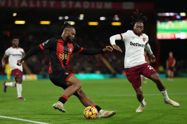 Antoine Semenyo vies with  Aaron Wan-Bissaka