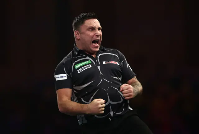 Gerwyn Price celebrates during his win over Connor Scutt