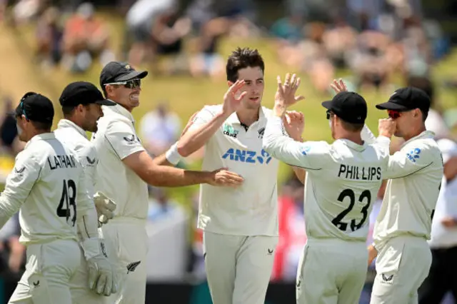 Will O'Rourke of New Zealand celebrates with his team after dismissing Harry Brook