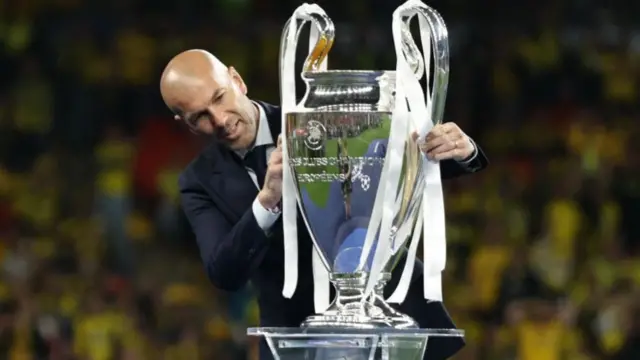 Zinedine Zidane with the Champions League trophy