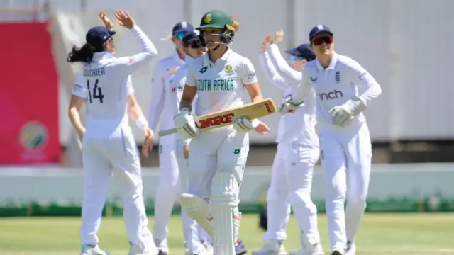 South Africa's Anneke Bosch leaves the field after being dismissed by Lauren Bell.