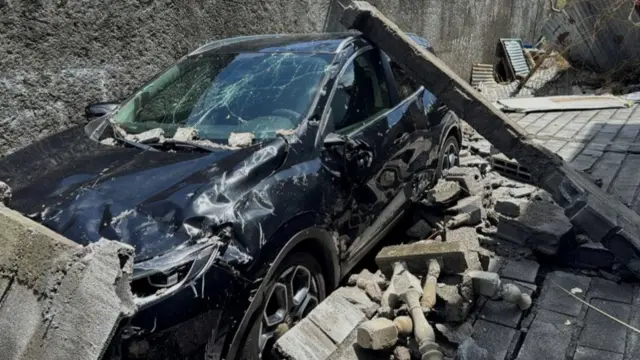 Car wrecked by cyclone in Mayotte