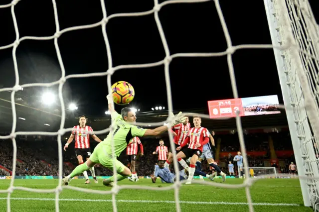 Southampton players watch on as Tottenham score