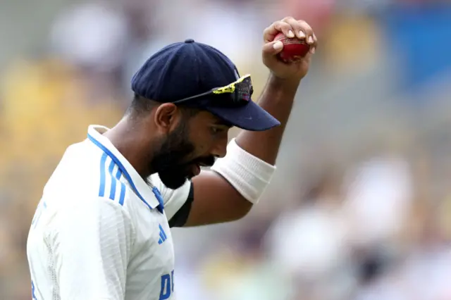 India bowler Jasprit Bumrah holds up the ball after taking 6-76