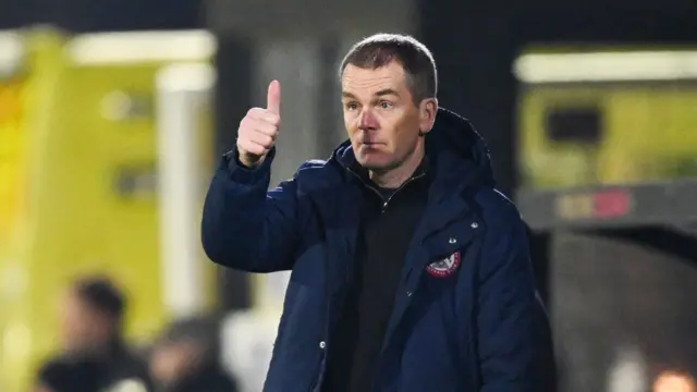 John Doolan giving a thumbs up to his Accrington Stanley players