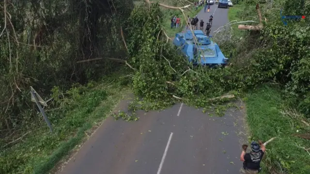 French Gendarmerie forces clear a road in the aftermath of Cyclone Chido, in Mayotte, France