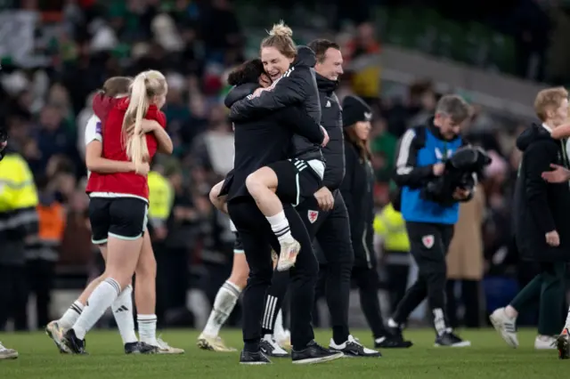 Wales coach Rhian Wilkinson celebrates with Jessica Fishlock