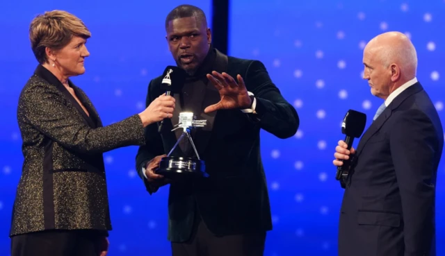 Mark Prince with the BBC Sports Personality of the Year Helen Rollason Award alongside Clare Balding and Barry McGuigan