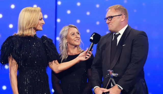 Trevor Painter and Jenny Meadows receive the Coach of the Year award