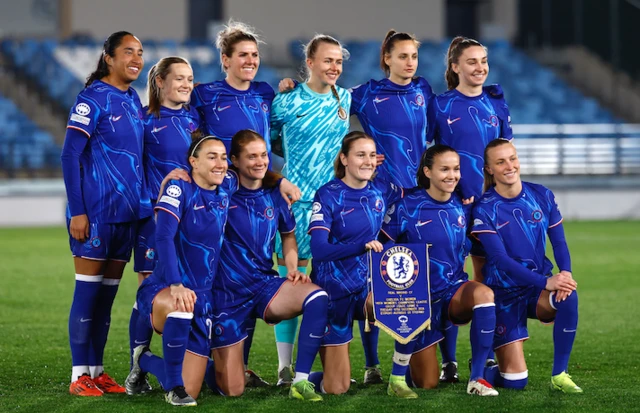 Chelsea players pose for a team group photo before the match