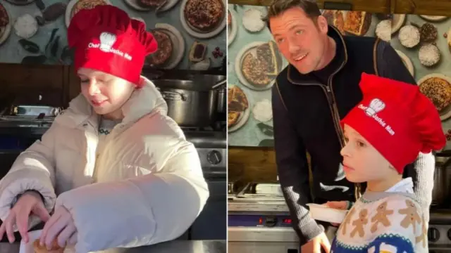 Young boy in red chef hat making pies with chef