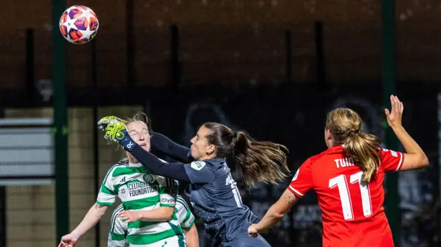 Celtic's Murphy Agnew (L) challenges FC Twente's Olivia Clark in the air during a UEFA Women's Champions League Group Stage Matchday One match between Celtic and FC Twente at the ZLX Stadium