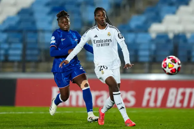 Naomie Feller of Real Madrid CF battles for the ball with Sandy Baltimore