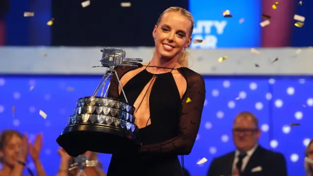 Keely Hodgkinson poses with the trophy