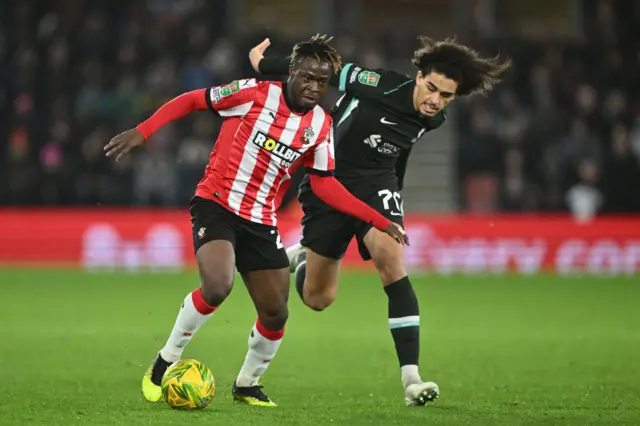 Kamaldeen Sulemana of Southampton is challenged by Jayden Danns