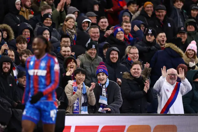 Crystal Palace fans smile in the stands