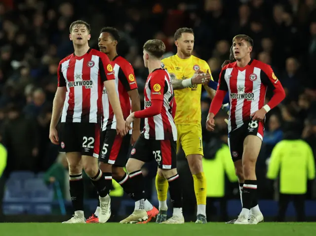 Brentford's Nathan Collins, Brentford's Ethan Pinnock, Brentford's Mark Flekken and Brentford's Yehor Yarmoliuk react after the match